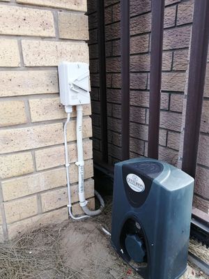 Installed generator with weatherproof housing and integrated switchgear
